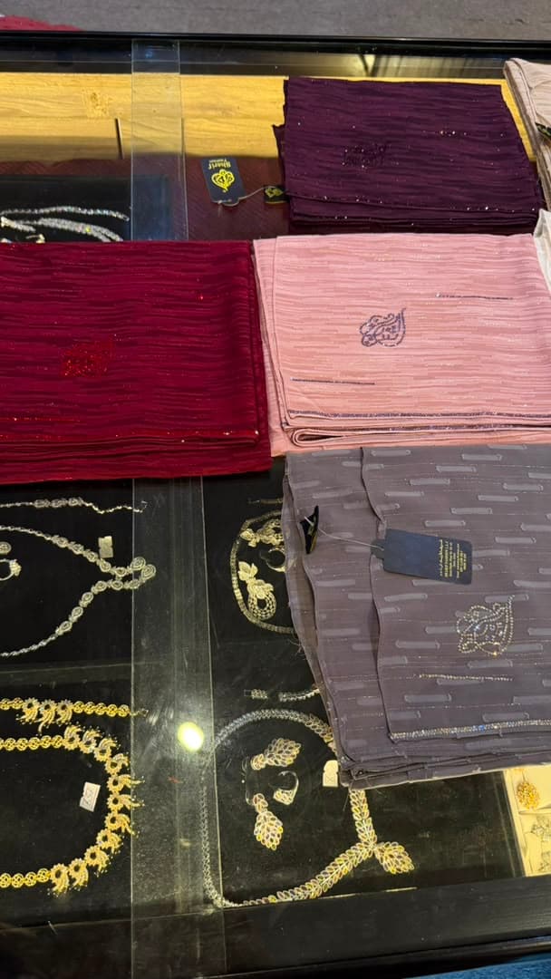 Shimmer chiffon veils draped over the jewellery counter